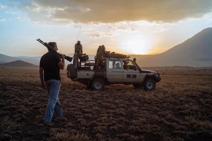 men with guns and a truck