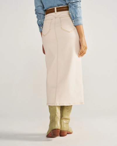 Now showing image 1 of 5: Person wearing a light denim shirt, cream-colored skirt with a front slit, tan belt with a large buckle, and light