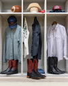 Three lockers with various items: a football, caps, shirts, jeans, cowboy boots, and a hat. The items appear to represent a Western or cowboy theme.