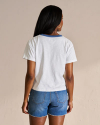 Backview of the women's vintage ringer tee on a woman in a photo studio