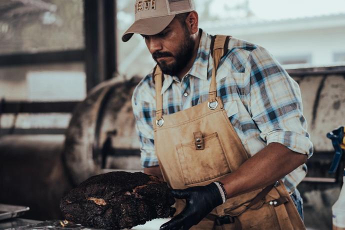 a man cooking bbq