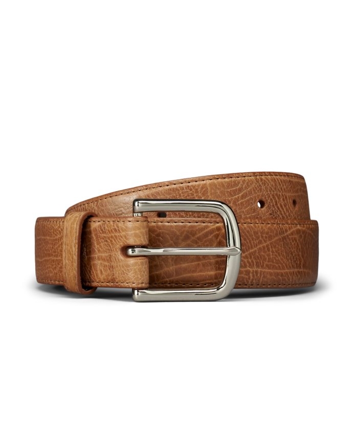 A brown suede leather belt with a brass buckle, coiled neatly against a plain white background.