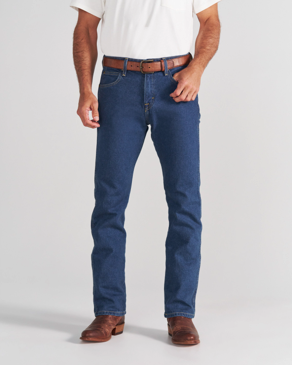 A person wearing a white t-shirt, blue jeans, a brown leather belt, and brown leather boots.