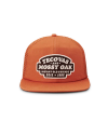 Front view of Tecovas x Mossy Oak Flat Brim Trucker - Rust on plain background