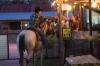 cowgirl on a horse at an outdoor bar