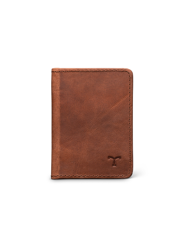 A brown leather wallet is standing upright against a plain white background. The wallet has visible stitching and a small embossed logo in the bottom right corner.