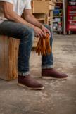 Man working in a garage wearing the Knox in Briar