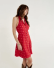Front view of Women's Sleeveless Collared Mini Dress - Red on model