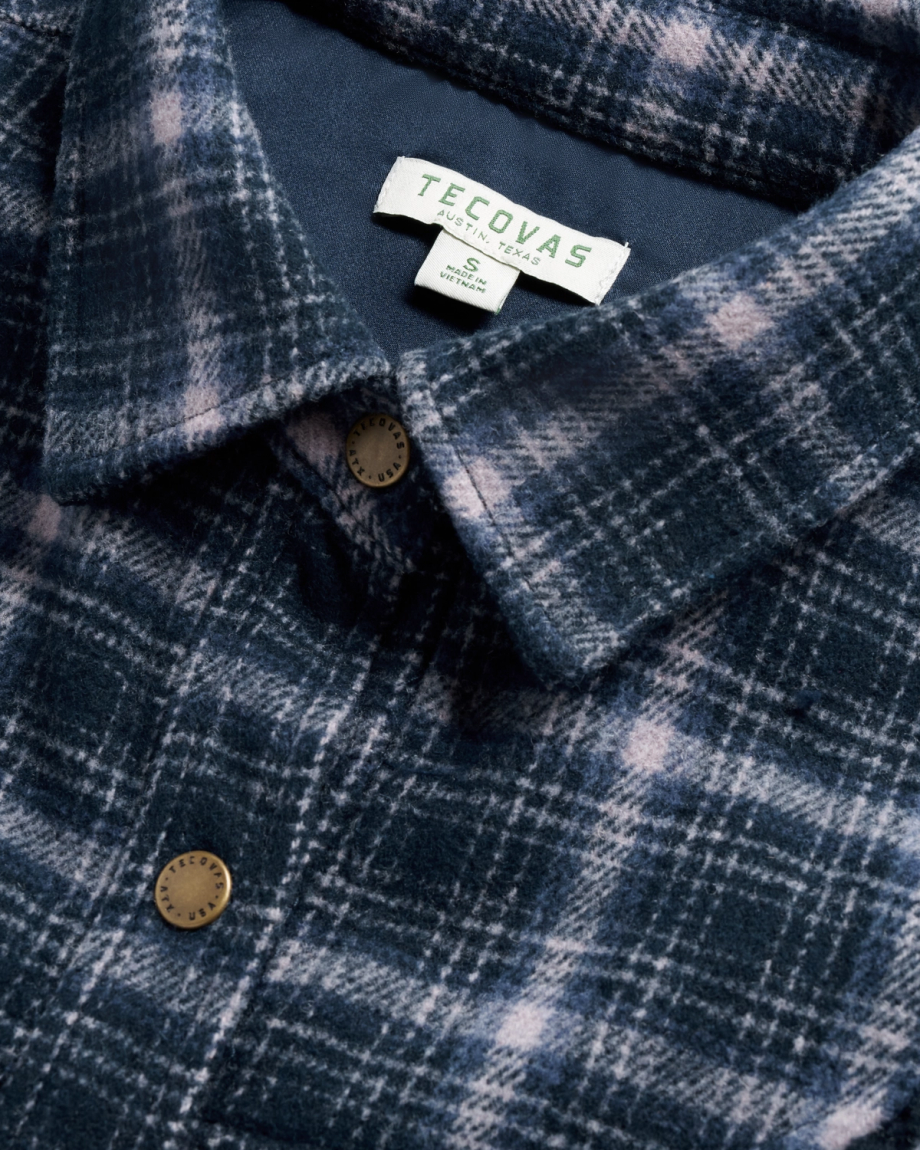 Closeup detail view of Women's Plaid Fringe Shacket - Navy / Mauve