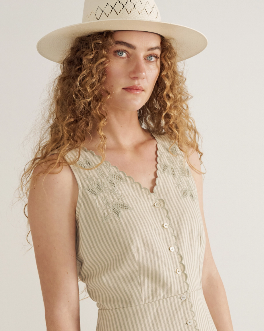 Front view of Women's Eyelet Linen Midi Dress - Green / White on model