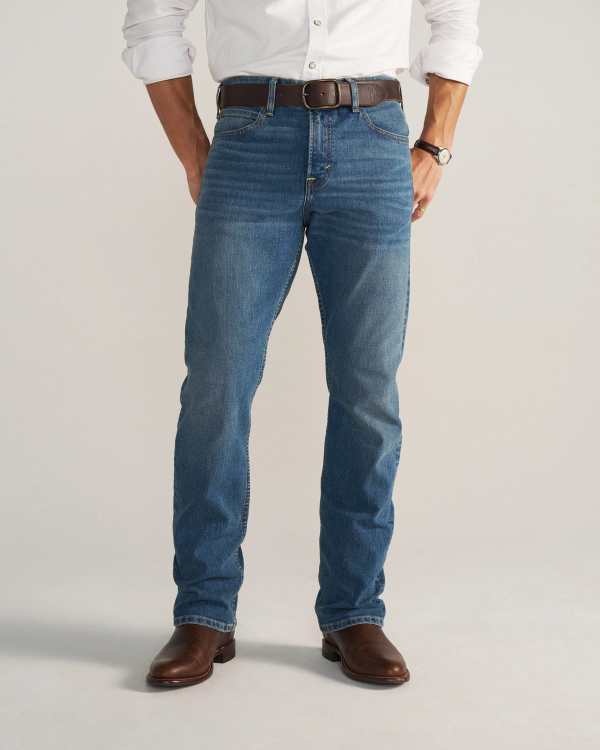 Front view of Men's Slim Straight Stretch Denim - Medium Indigo on model