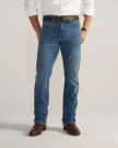 Front view of Men's Slim Straight Stretch Denim - Medium Indigo on model