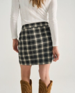 Back view of Women's Plaid Mini Skirt - Black / White on model