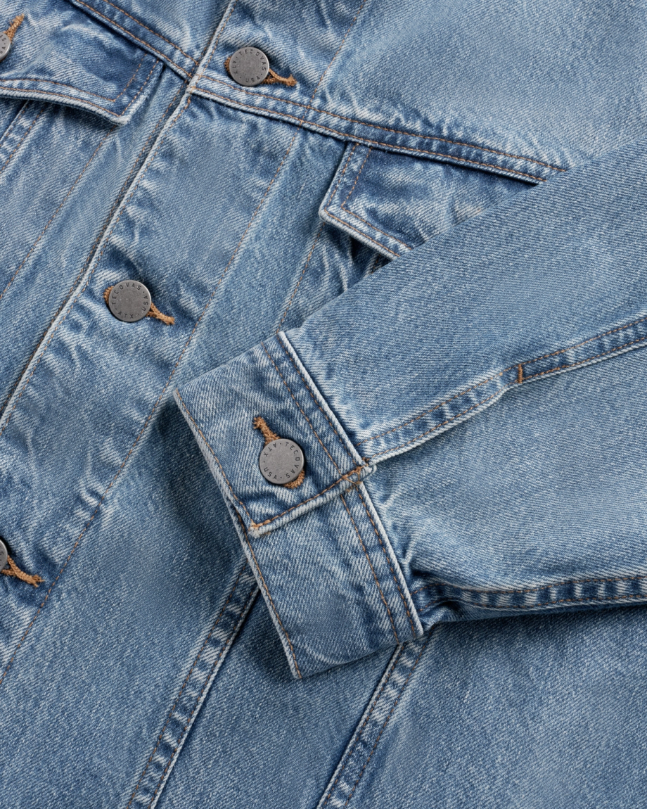 Closeup view of Men's Classic Denim Trucker Jacket - Acid Wash