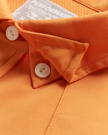 Closeup detail view of Men's Performance Western Pearl Snap SS - Burnt Orange