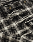 Closeup detail view of Women's Plaid Fringe Shacket - Black / White