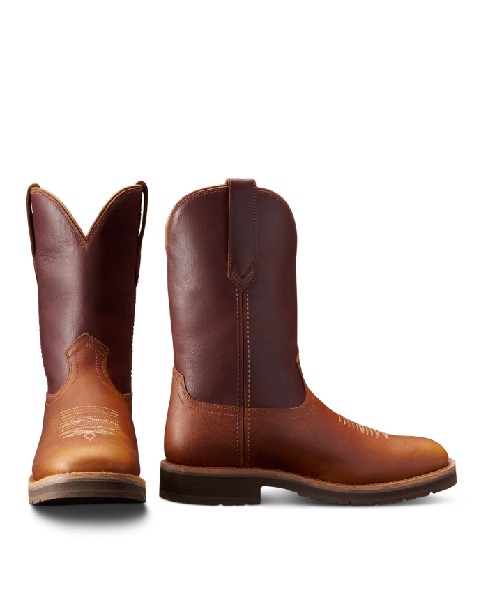 Two brown cowboy boots made of leather, one facing forward and the other to the side, against a white background.