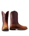 Two brown cowboy boots made of leather, one facing forward and the other to the side, against a white background.