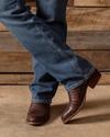 close up picture of Dillon Mahogany brown cowboy boots on a man's feet