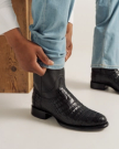 close up picture of Cole Midnight Black cowboy boots on a man's feet