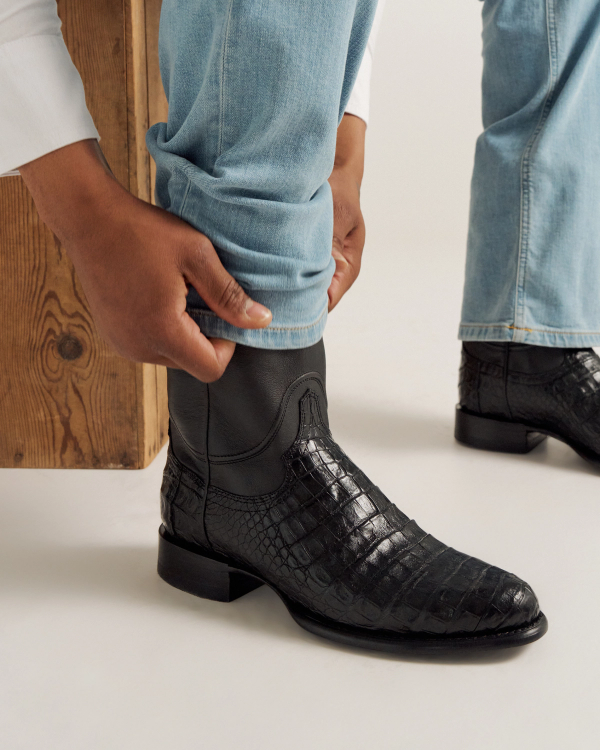 close up picture of Earl Carbon Black cowboy boots on a man's feet