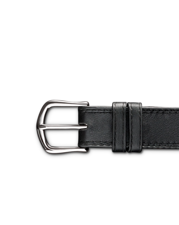 Black leather belt on a black background with a shiny silver buckle.