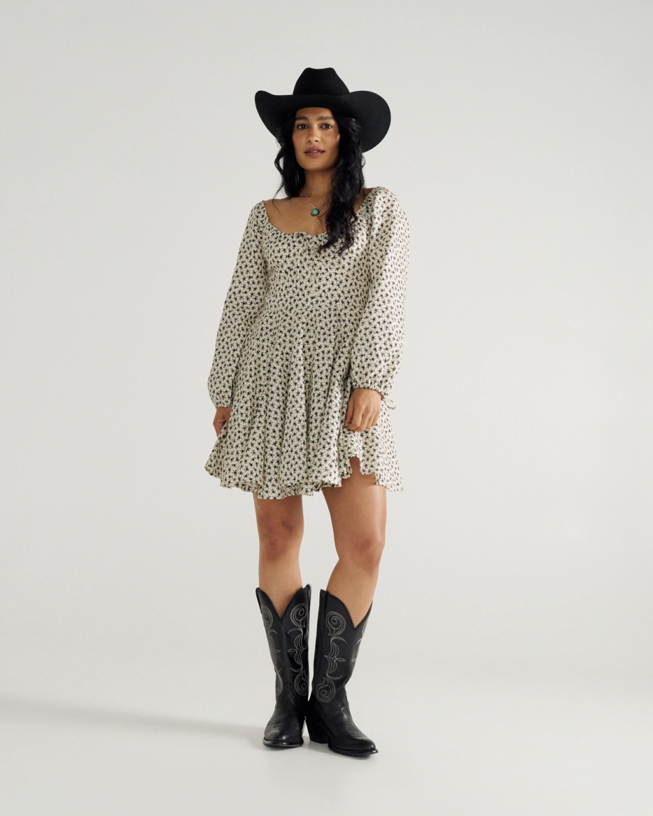 Full view of Women's L/S Mini Dress - Cream / Black on model