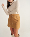 Front view of Women's Mini Suede Skirt - Tan on model