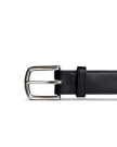 Black leather belt with a silver buckle against a black background.