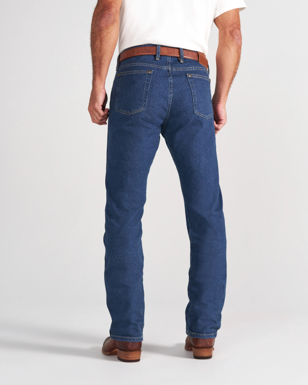 Back view of a person wearing blue jeans, a white shirt, a brown belt, and brown boots.