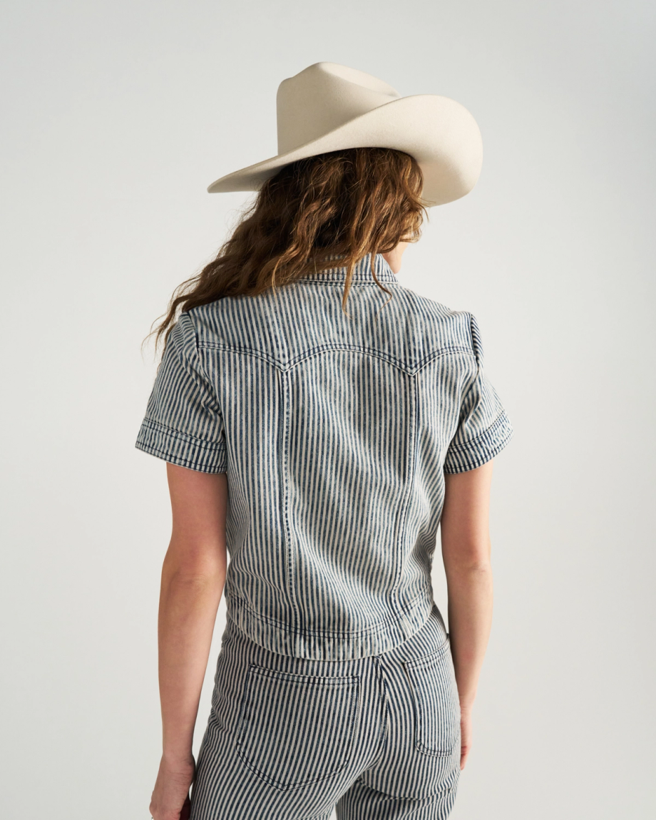 Back view of Women's S/S Denim Top - Blue / White on model