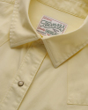Closeup detail view of Women's Vintage Weight Sawtooth Cotton Pearl Snap - Dusty Yellow
