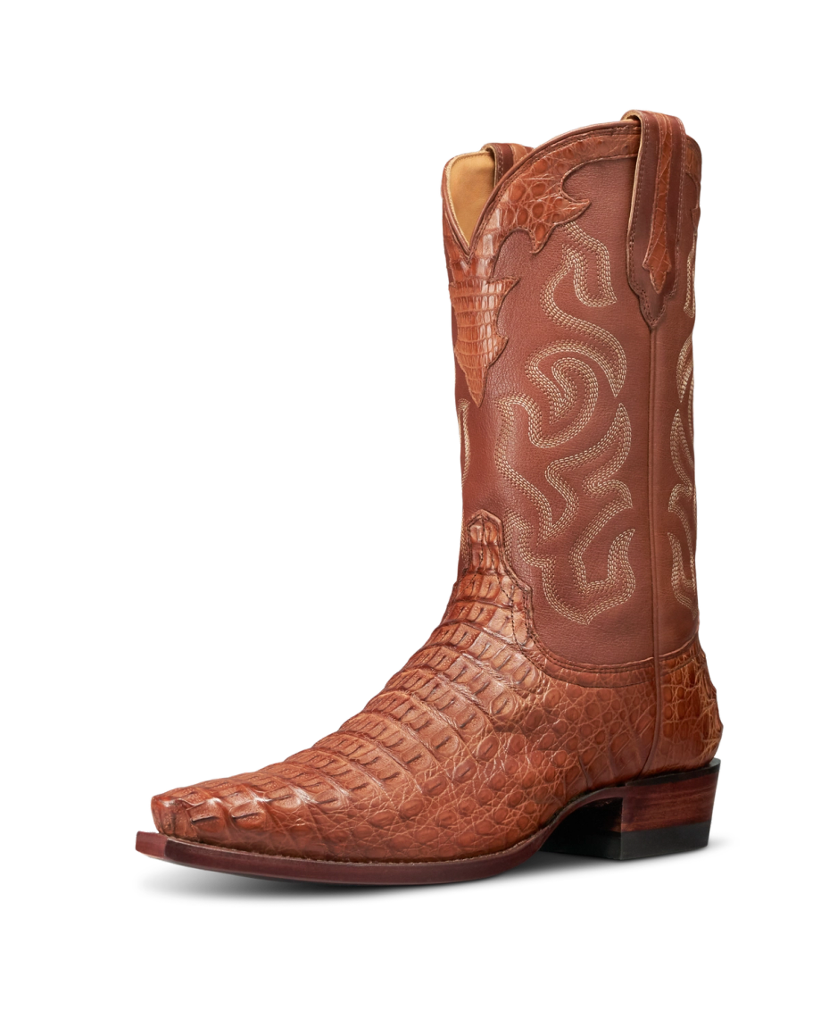 The Garrett Hornback Caiman brown cowboy boot features textured, crocodile-patterned leather on the foot and decorative stitching on the shaft, showcasing a pointed toe and stacked heel in rich Pecan Hornback Caiman.