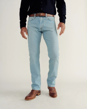 Front view of Men's Slim Straight Stretch Denim - Light Stone Wash on model