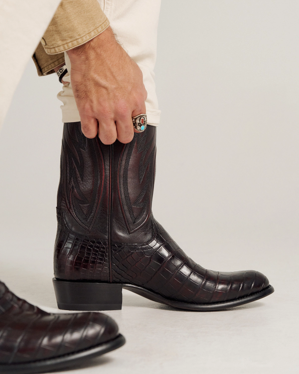 close up of Cooper Black Cherry Cowboy Boot on a man's feet 