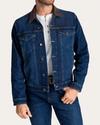 Man wearing dark blue wash denim trucker Jacket