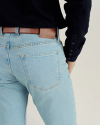 Closeup view of Men's Slim Straight Stretch Denim - Light Stone Wash