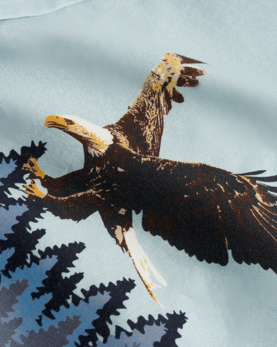 Closeup detail view of Men's Thorn Stopper Short Sleeve Pearl Snap - Aquamarine/Navy