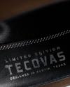 Close-up of black leather with white stitching, displaying the text: "Limited Edition Tecovas Designed in Austin Texas.