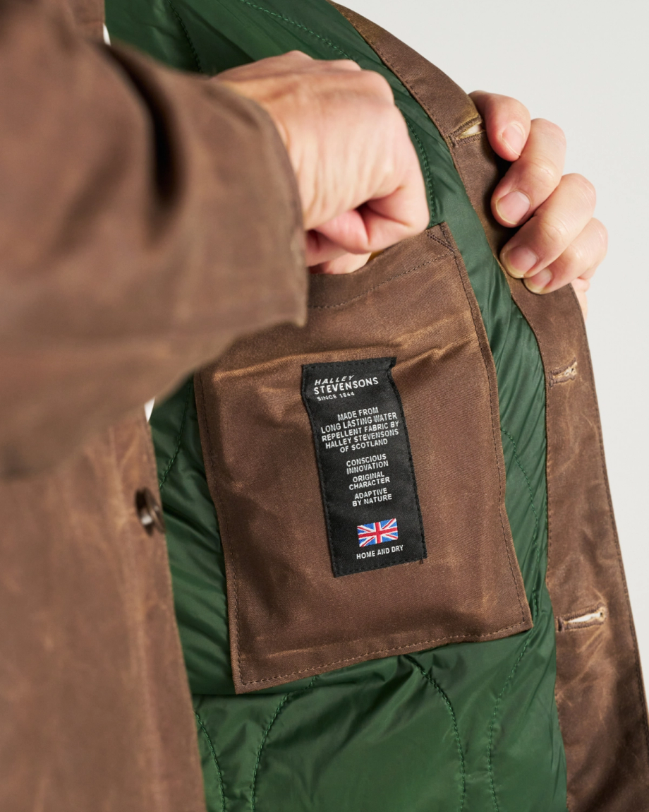 Close Up of Buckaroo Waxed Canvas Trucker Jacket - Tobacco on model