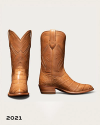 Tan leather cowboy boots with textured reptilian-style vamps.