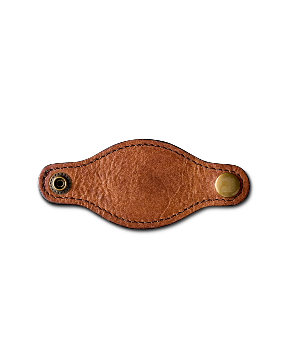A brown leather strap with curved edges, visible stitching, a metal snap button on one end, and a metal eyelet on the other, displayed on a plain white background.