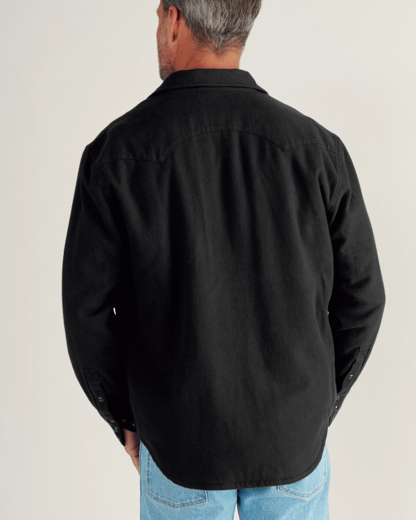 Closeup detail view of Men's Sawtooth Pearl Snap Shacket - Black