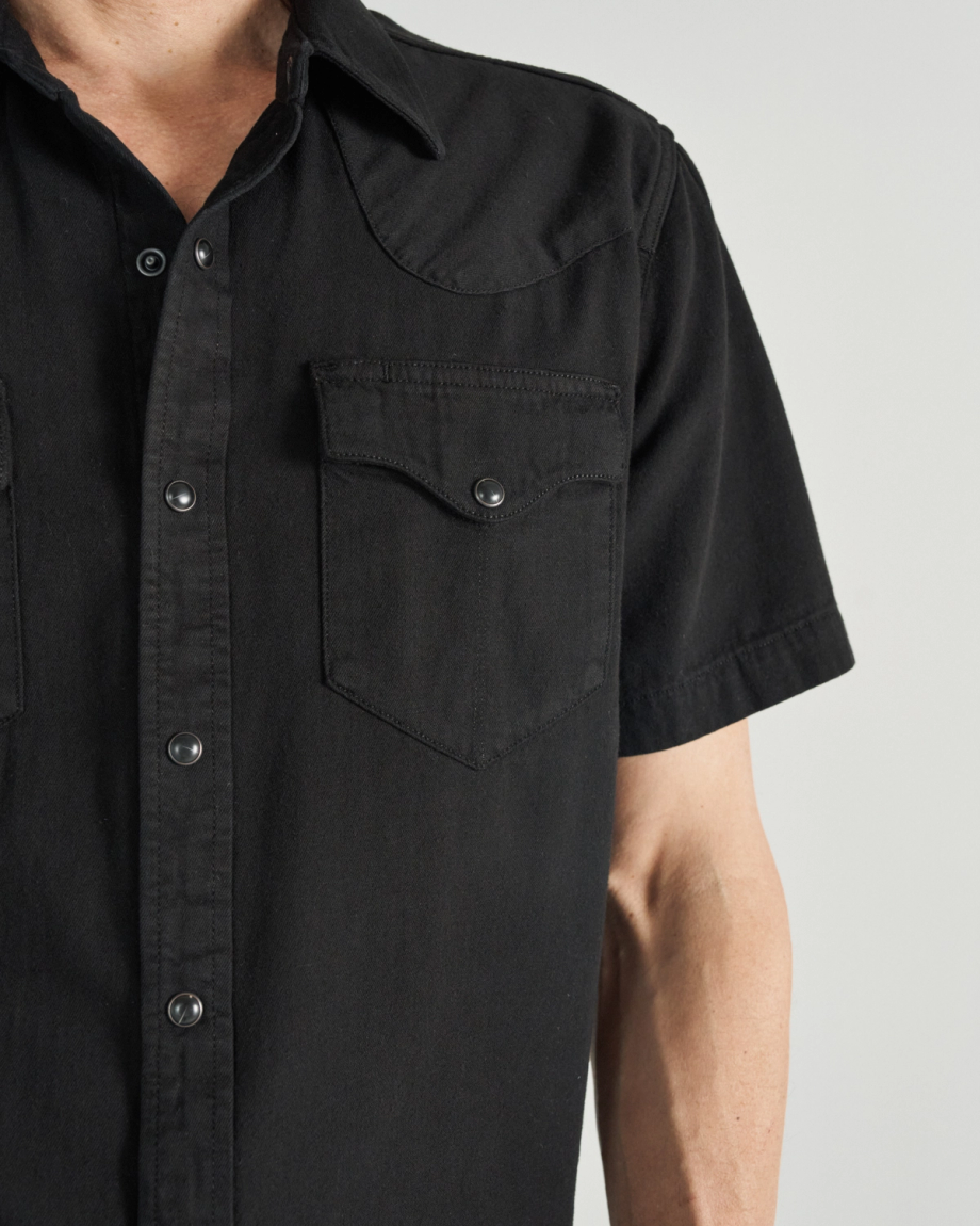 Closeup detail view of Men's Denim Pearl Snap SS - Black