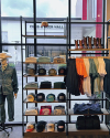 Interior of a boot store with shelves of various styles of western clothing 