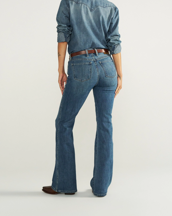 Back view of Women's Mid-Rise Slim Flare - Medium Wash on model