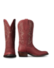 The Britt in Redwood Goat. Pair of red leather Redwood Goat cowboy boots with decorative stitching, stacked heels, and pull tabs, shown upright with one boot facing forward and the other in profile against a white background.