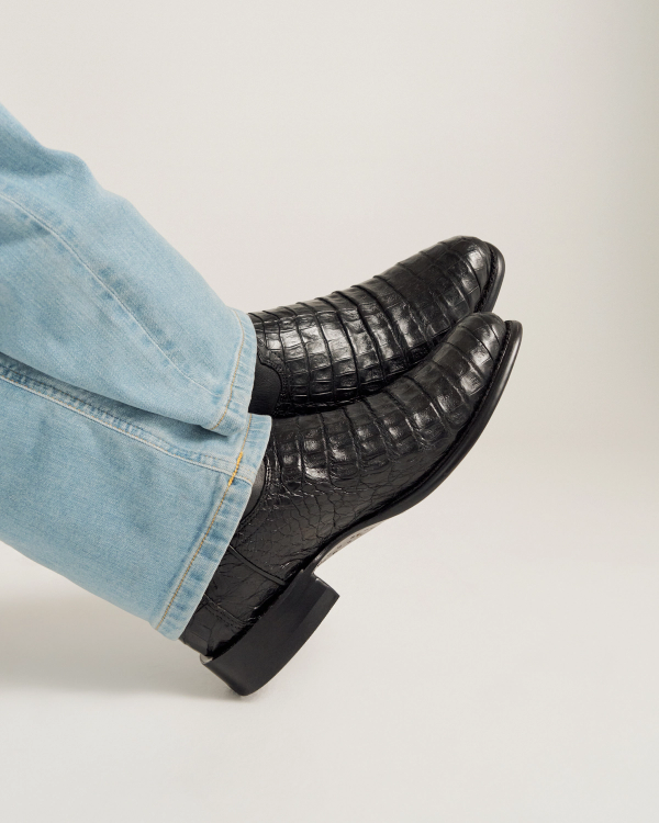 close up picture of Earl Carbon Black cowboy boots on a man's feet