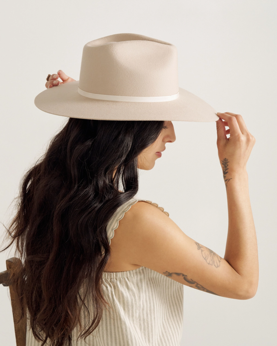 Front view of The Belle Wool Cowgirl Hat - Cream on model