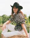  The Charlotte Top by Kristopher Brock - Black/Bone Floral on woman at a farm